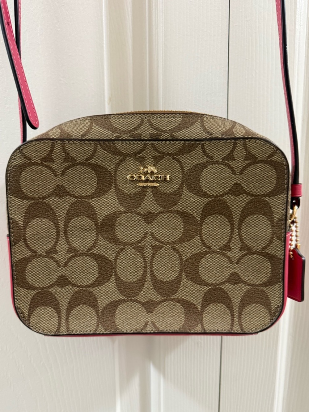 Coach Signature camera crossbody bag in brown monogram canvas with vibrant pink